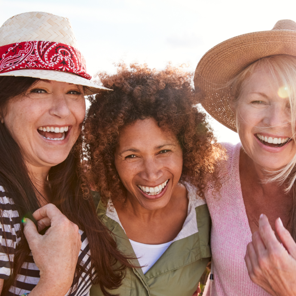 Three women expressing their midlife female friendships.